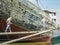 Jakarta, Indonesia - July 13, 2009: unskilled workers loading sacks with cement onto a wooden transport vessel