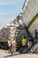 Jakarta, Indonesia - July 13, 2009: unskilled workers loading sacks from a truck onto a wooden transport vessel