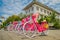 JAKARTA, INDONESIA: Row of pink bicycles with matching hats parked in front of Jakarta history museum on a beautiful
