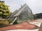 Jakarta, Indonesia September 10-2023: The iconic greenhouse building in Menteng Park is a characteristic view of the park