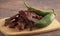 Jalapeno Flavored Gourmet Beef Jerky on a Wooden Cutting Board