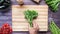 Jalapeno peppers , asparagus, cherry tomato, lettuce on chopping board