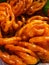 Jalebi is a popular Indian sweet snack in pretzel or circular shapes