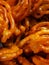 Jalebi is a popular Indian sweet snack in pretzel or circular shapes