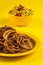 Jalebi and Traditional Indian deep fried salty dish called chivda or mixture or farsan