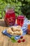 Jam shortbread cookies and red compote with cherries, strawberries, gooseberries, raspberries and apricot jam