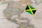 Jamaica flag pin on world map