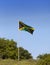 Jamaica. National flag on the green hill