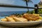 Jamaican breakfast of bammy, plantain, ackee and sailfish, callaloo