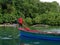 Jamaican fisherman paddling on a boat