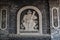 Jambi, Indonesia - October 7, 2018 : Carved statue of Buddhist deity on Vihara Satyakirti walls