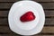 A Jambu Guava on White Plate on Wood Bakcground