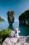 James bond Island Phangnga Bay Thailand, couple visit the Island, traveler on tropical sea beach near Phuket, Travel