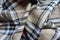 Jammed beige, black and white flannel tartan fabric