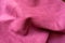 Jammed bright cerise-colored faux suede fabric