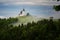 Jamnik church on a hillside in the spring, foggy weather at sunset in Slovenia, Europe. Mountain landscape shortly after spring ra