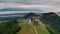 Jamnik, Slovenia - Aerial time-lapse hyperlapse footage of drone flying by St Primoz church on a foggy summer morning