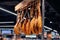 Jamon hangs on a crossbar in a supermarket. Blurred background
