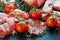 Jamon Serrano sliced with small cherry tomatoes and fresh thyme on black stone background