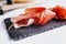 Jamon serrano. Traditional Spanish ham, Slicing of dry-cured ham in Spain