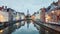 Jan van Eyck Square over the waters of Spiegelrei, Bruges