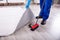 Janitor Cleaning Dirt Under The Carpet