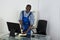 Janitor Cleaning Glass Desk With Cloth In Office