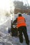 Janitor cleans snow.