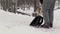 Janitor with snow shovel clean sidewalk from the snow