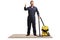 Janitor in a uniform with a vacuum cleaner standing on a carpet with thumbs up