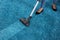 Janitor Using Vacuum Cleaner For Cleaning Carpet