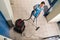 Janitor Vacuuming Floor