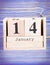 January 14th. Date of 14 January on wooden cube calendar