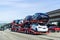 January 19, 2019 San Bruno / CA / USA - Car transporter carries Tesla Model 3 new vehicles along the highway in San Francisco bay