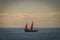 January 2015, sailboat with red sails on the coast in front of Casas de Duque, Adeje. Tenerife