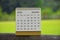 January 2025 white calendar with green blurred background. New year concept.