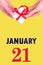 January 21st. Festive Vertical Calendar With Hands Holding White Gift Box With Red Ribbon And Calendar Date