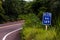 January 3, 2016, Brazil. Indicative plate in the middle of the bush in Mato Grosso do Sul. Dangerous curve ahead