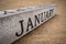 January text on grunge wooden block