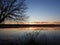 January winter sunset on calm waters of Cayuga Lake