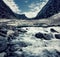 Janury 2019, Gulmarg, kashmir, India.Tourists at the valley of Gulmarg. The valley is frozen and river is originating from the