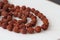 Japa mala. Prayer beads made from the seeds of the rudraksha tree. close-up
