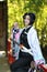 Japan anime cosplay portrait of girl with comic costume with japanese theme garden