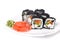 Japan black tobiko rolls with cream cheese and salmon served wit