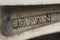 Japan-convex inscription casting on the alloy spokes of an aluminum cast wheel.