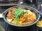 Japan cuisine, soup with pork, udon, vegetable in hot pot