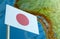 Japan flag with a globe map as a background