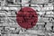 Japan flag painting on high detail of old brick wall