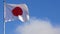 Japan flag waving against blue sky