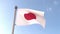 Japan flag waving isolated with blue sky in background. Close up of Japanese flag, 3d rendering